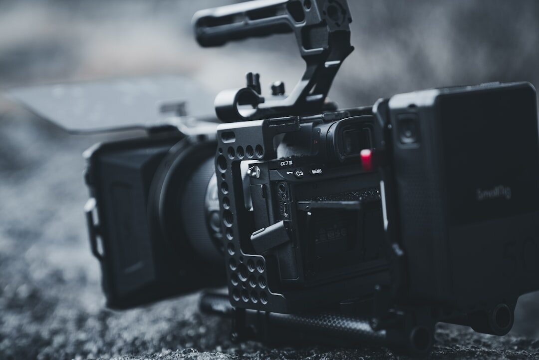 Close-up of a professional video camera and lens